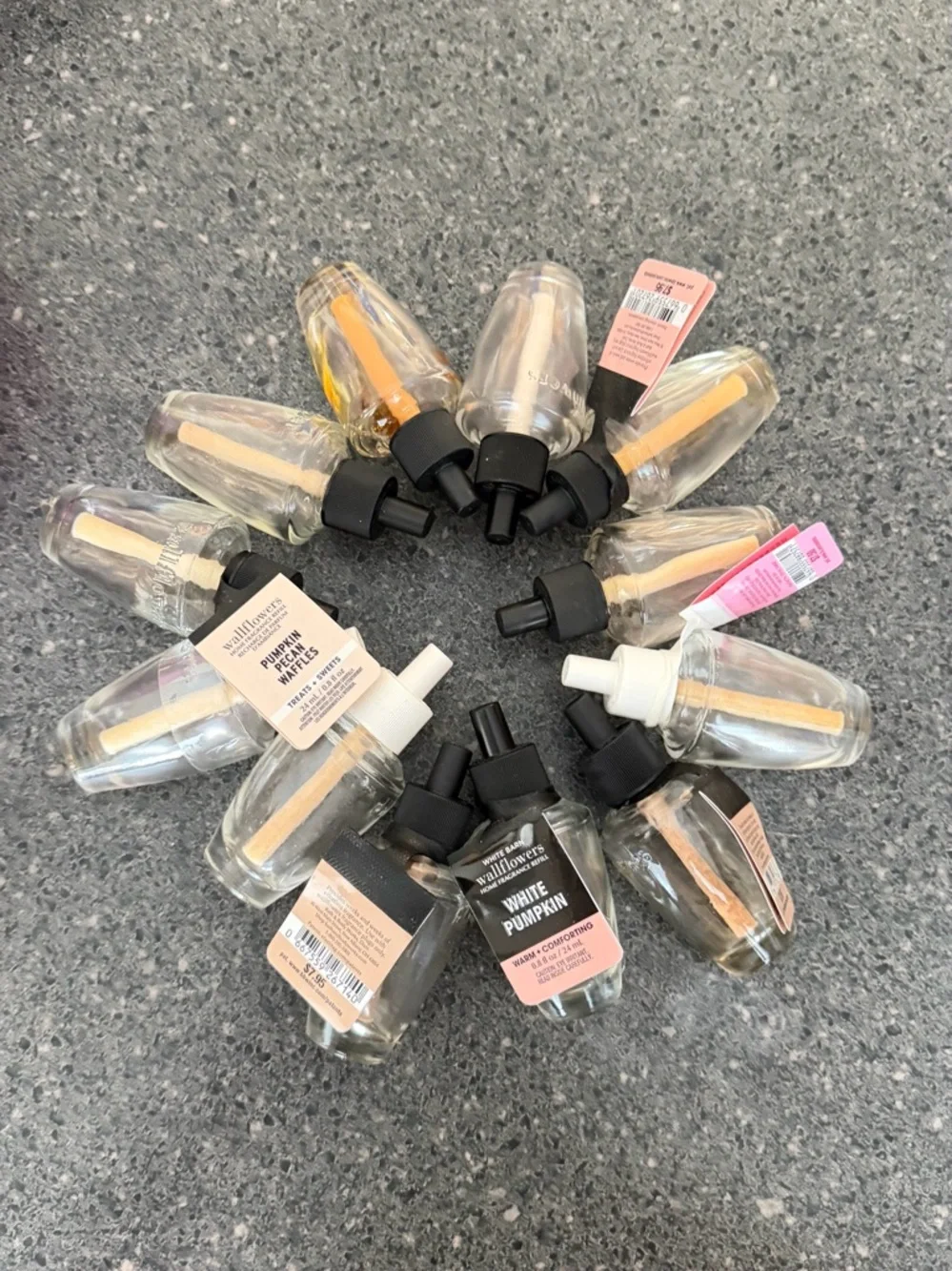 12 Empty wallflower refill bottles